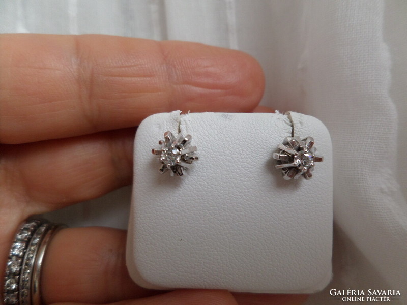 A pair of white gold stud earrings