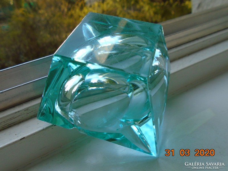 Faceted turquoise crystal decorative glass with an oval recess