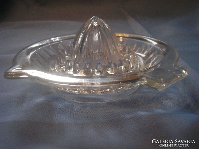 Antique lemon squeezer in a thick-walled glass