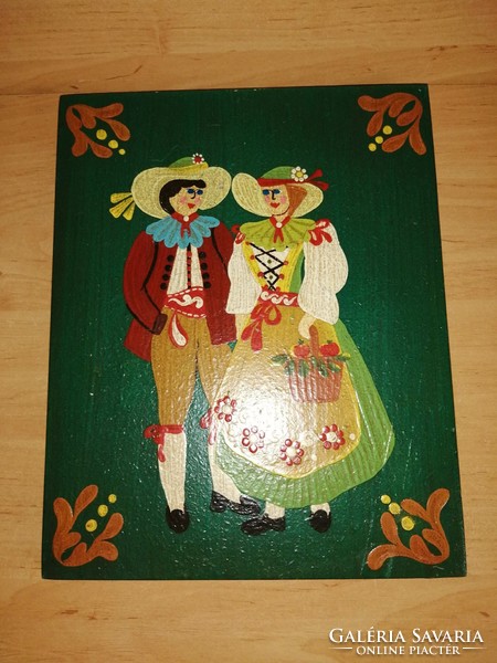 A wooden wall picture of a Dutch couple in folk costume, painted in very nice cheerful colors, 24*30 cm