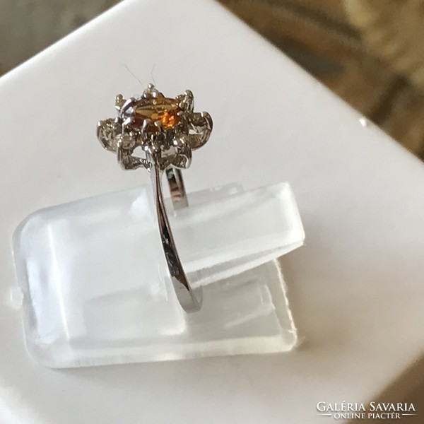 Marked 14k white gold ring with 0.08 ct brill and topaz