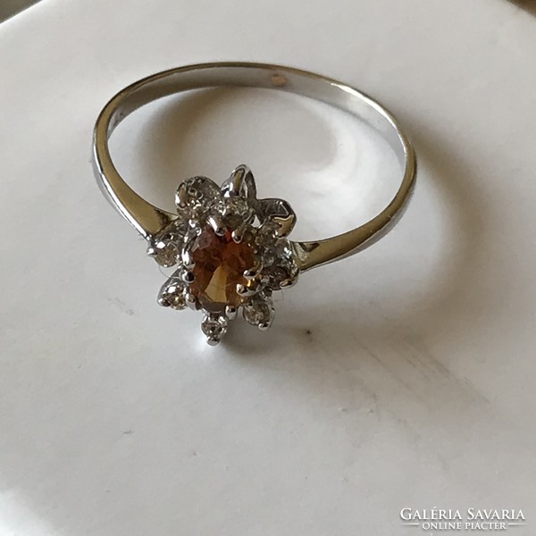 Marked 14k white gold ring with 0.08 ct brill and topaz