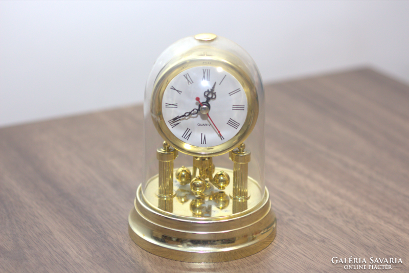 Rotating table clock with wind chime