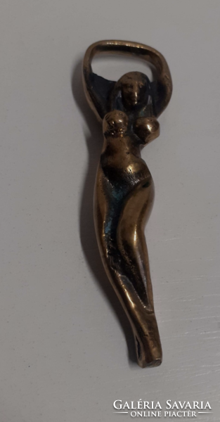 Old copper beer opener in the shape of a woman
