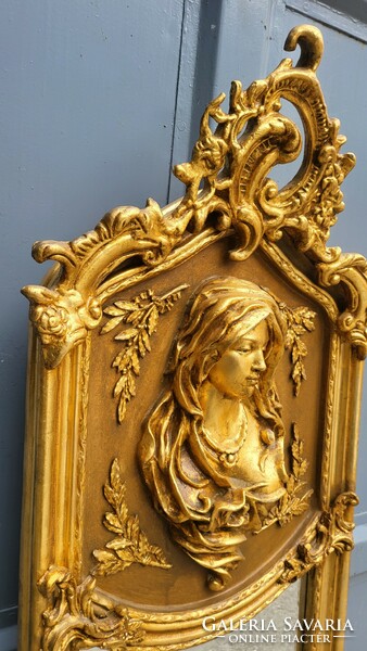 Gilded mirror in the shape of a woman