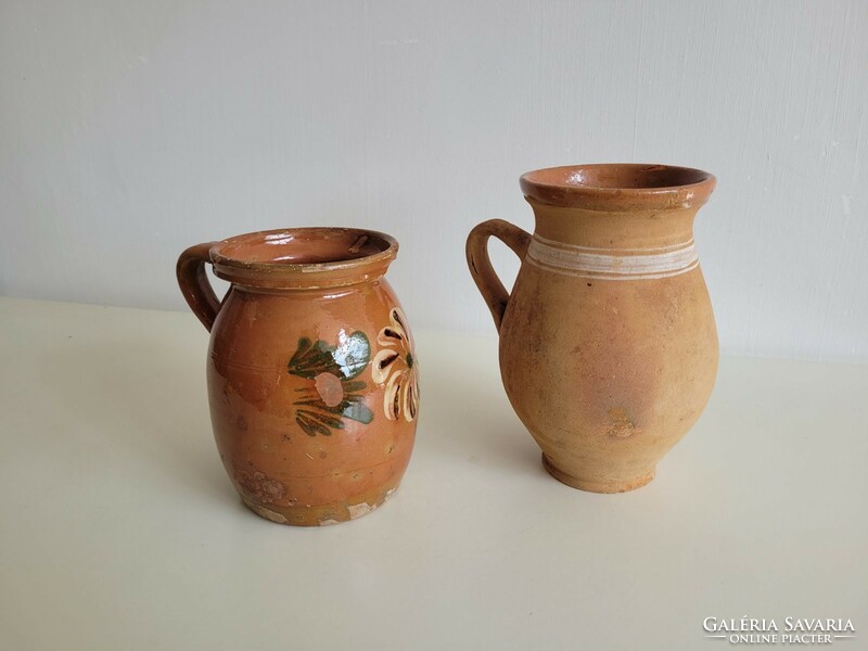 Old folk earthenware jug with brown glaze and flowered straw, 2 milk jugs