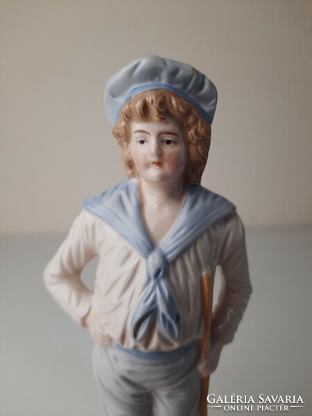 Antique ceramic statue, figure of a young sailor