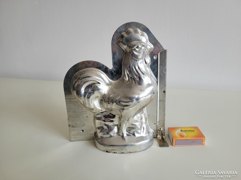 Old metal baking mold in the shape of a rooster, chocolate pouring mold, chicken poultry, Easter confectionery