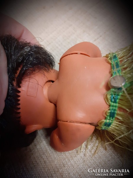Old sleeping rubber doll in good condition with braided combable hair