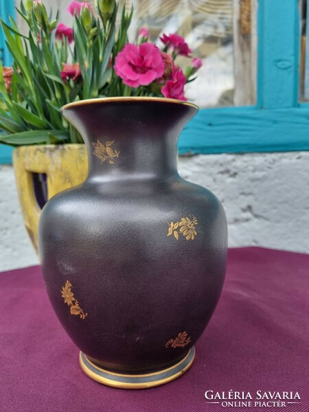 A porcelain vase from Hollóháza with black and gold flowers