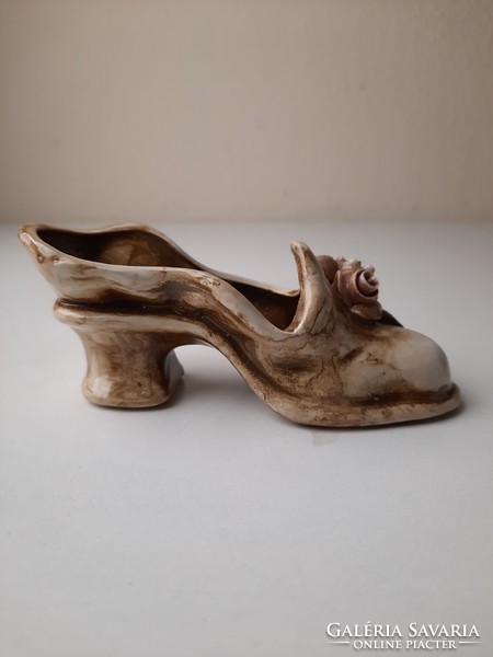 Antique ceramic ornament in the shape of women's shoes