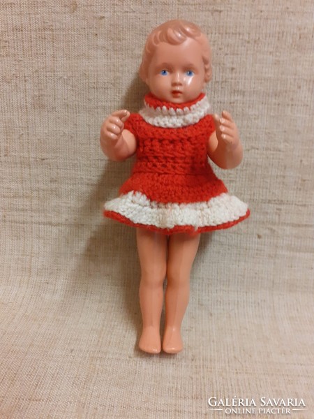 Old rubber doll with a nice face, in a good condition, in a nice dress with a turtle mark on the back