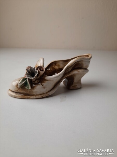 Antique ceramic ornament in the shape of women's shoes