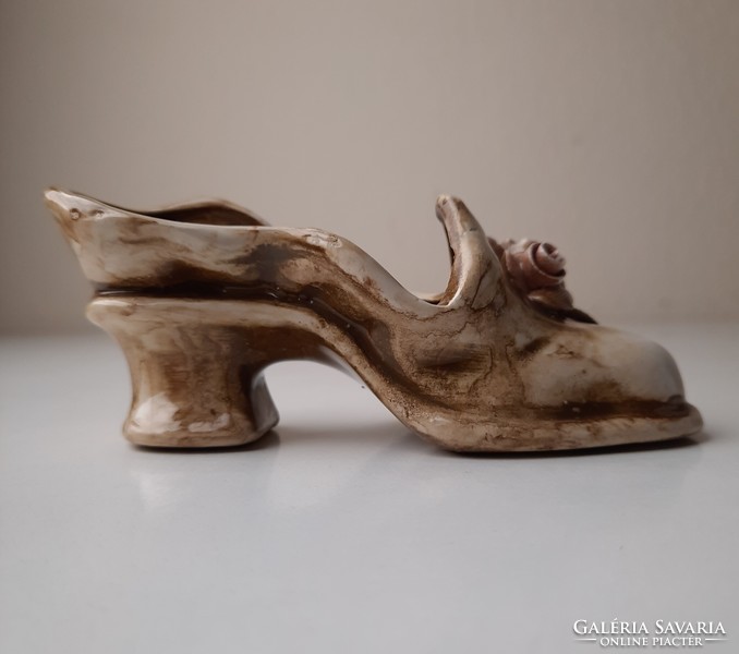 Antique ceramic ornament in the shape of women's shoes