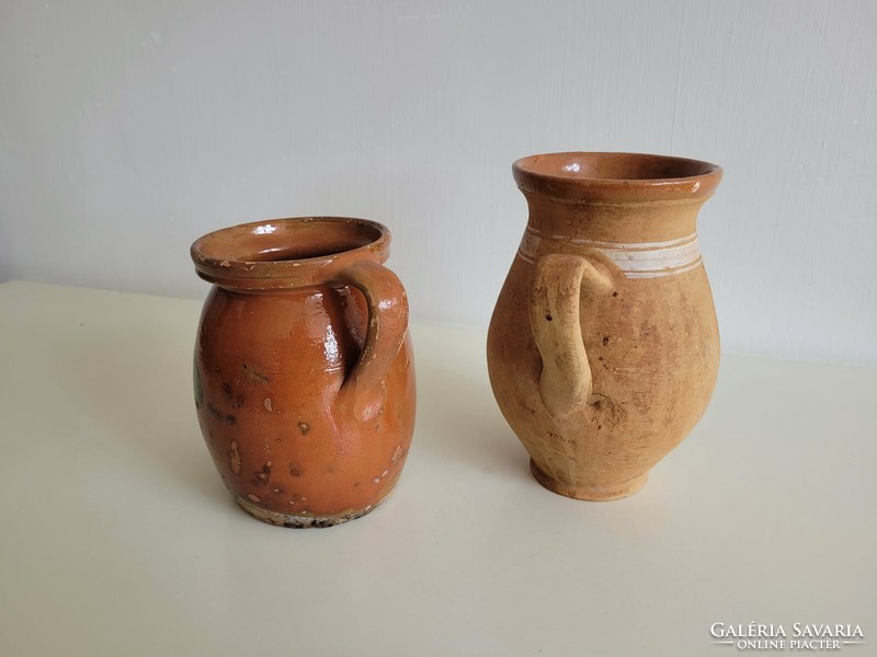 Old folk earthenware jug with brown glaze and flowered straw, 2 milk jugs