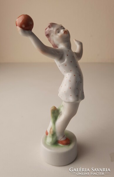 Retro porcelain statue, figure of a little girl playing a ball