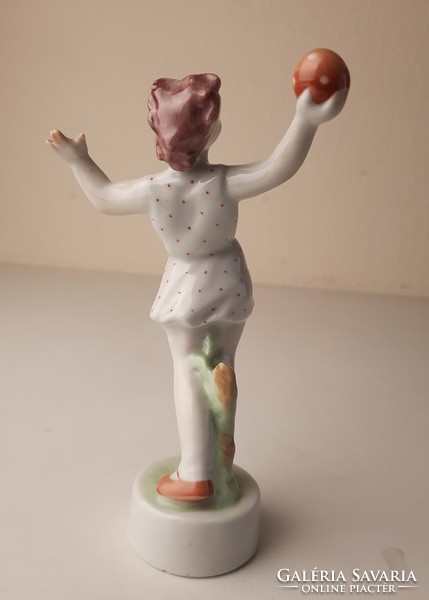 Retro porcelain statue, figure of a little girl playing a ball