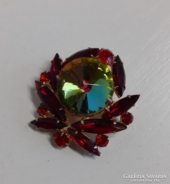 Retro beautiful brooch with gilded polished set stones and a large Murano stone in the middle