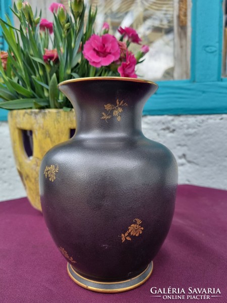 A porcelain vase from Hollóháza with black and gold flowers