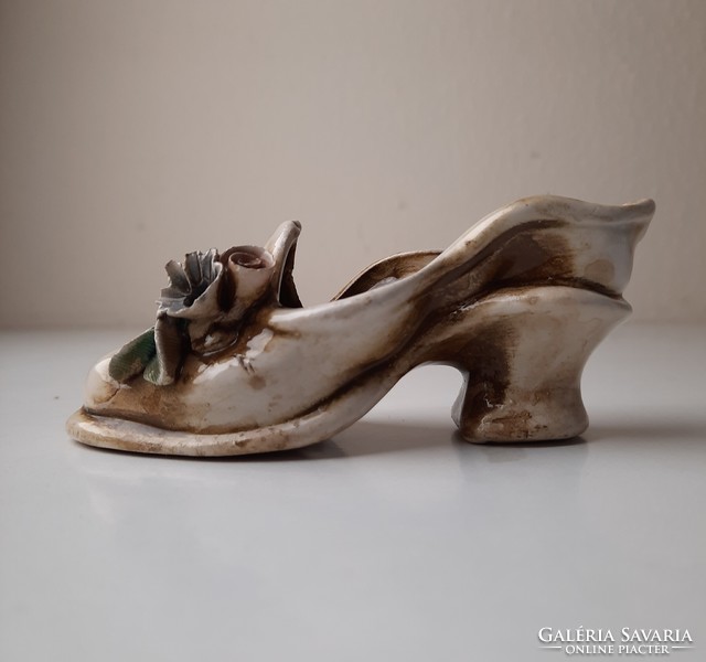 Antique ceramic ornament in the shape of women's shoes