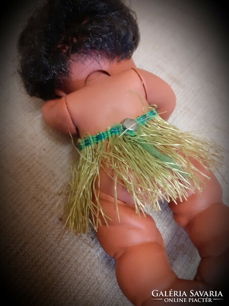 Old sleeping rubber doll in good condition with braided combable hair