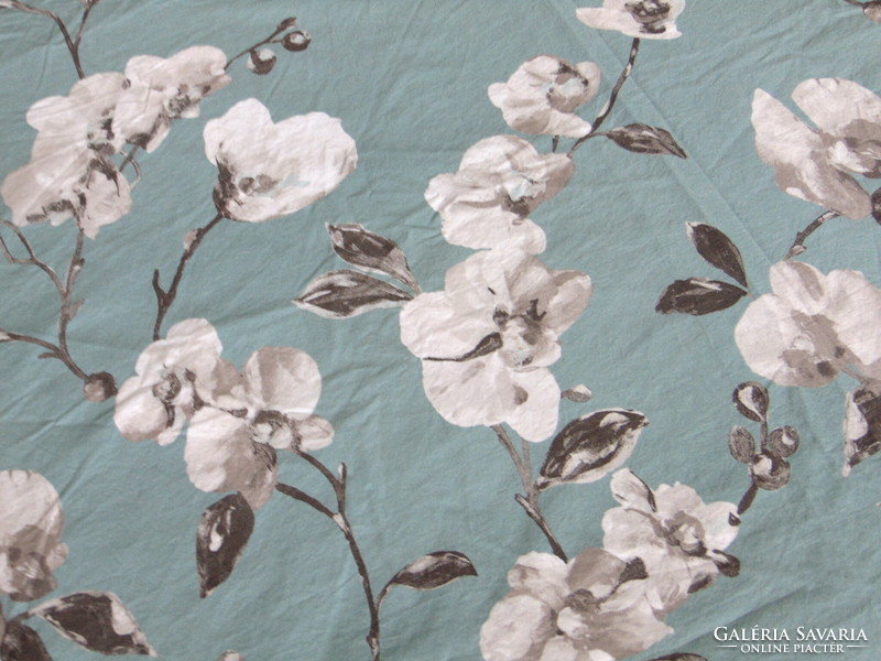 Beautiful cotton bed linen with white flowers on an olive green background