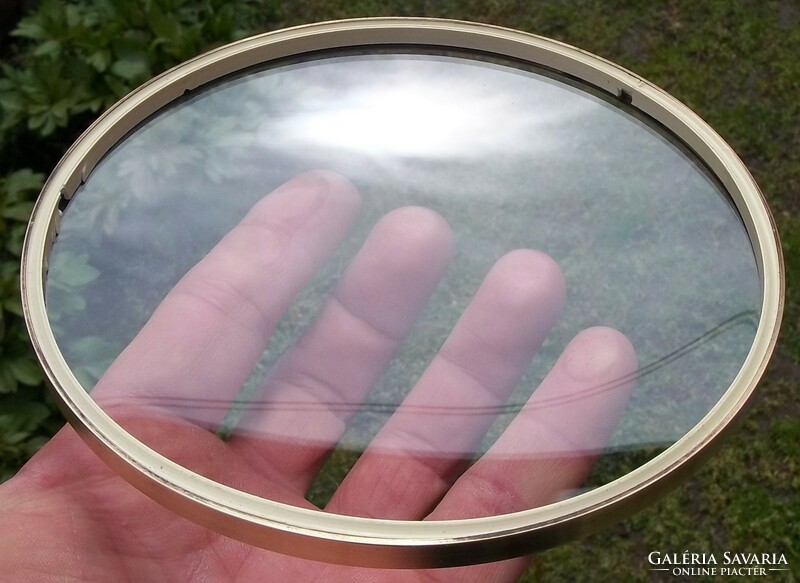 Convex watch glass with a copper rim