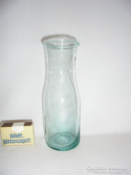 Antique turquoise glass bottle with a broken bottom