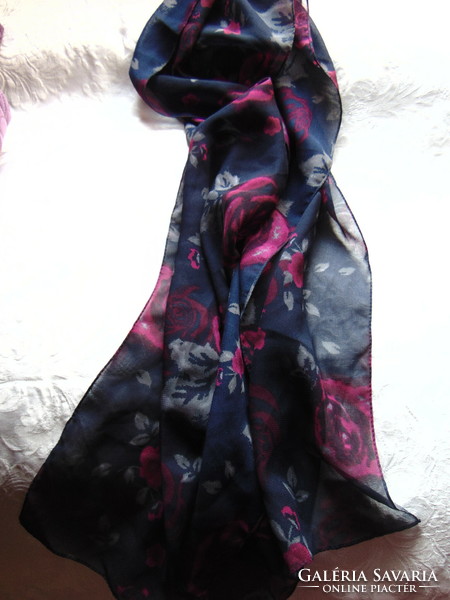 Beautiful pink scarf on a dark blue background
