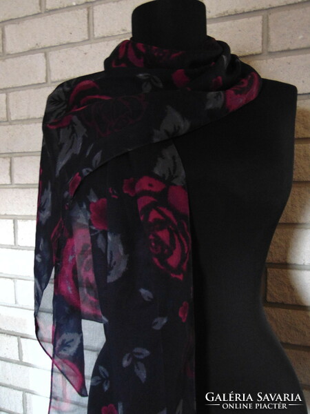 Beautiful pink scarf on a dark blue background
