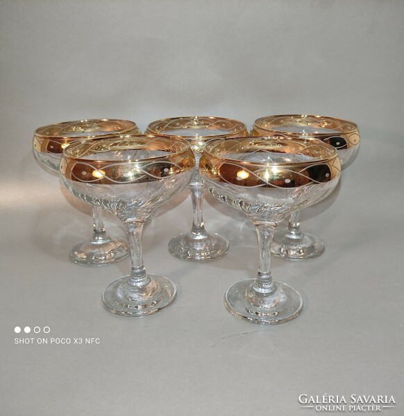 Worth the price!!! Set of 5 champagne glasses with gilded rim marked crystal mode