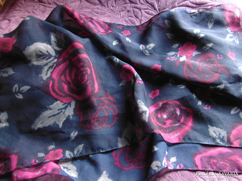 Beautiful pink scarf on a dark blue background