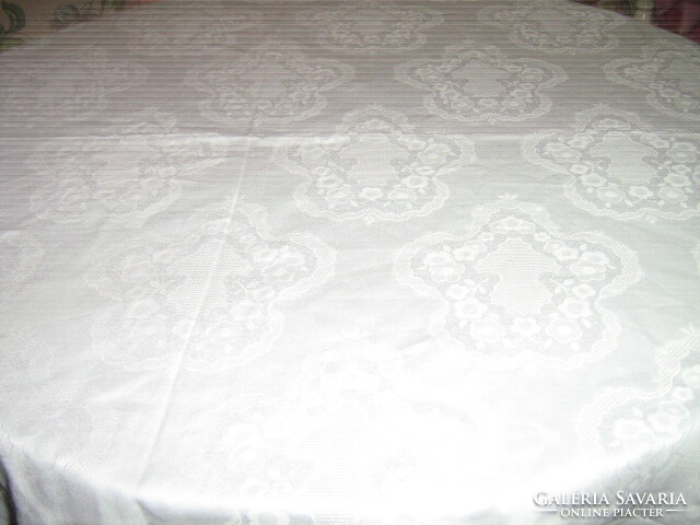 Beautiful damask tablecloth with hand-crocheted flower and Toledo pattern