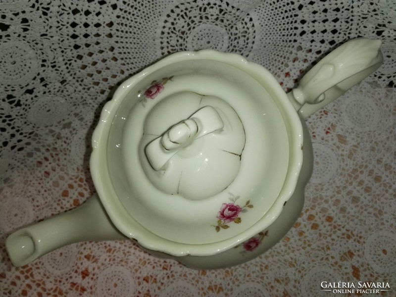 Old, red rose porcelain tea spout.