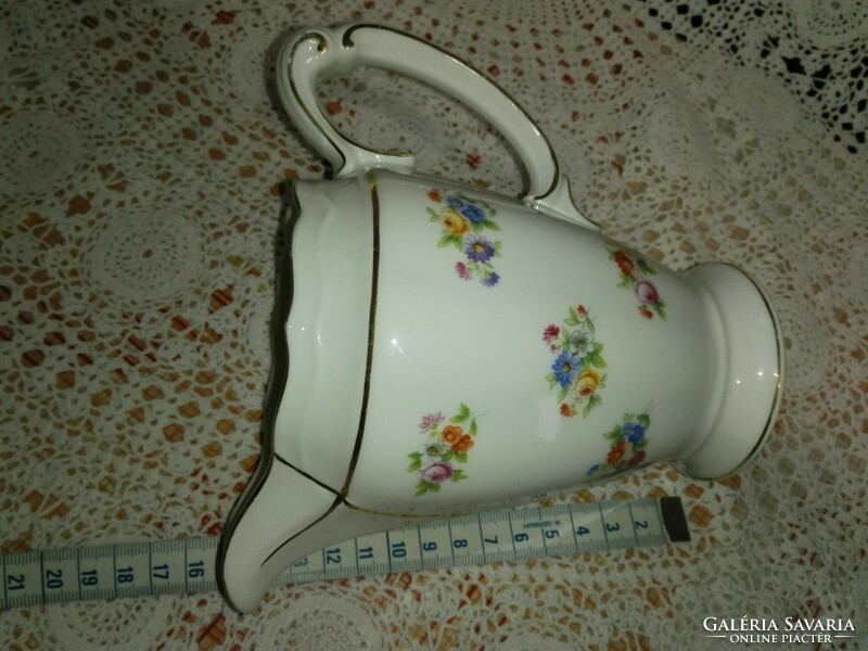 Floral porcelain spout.