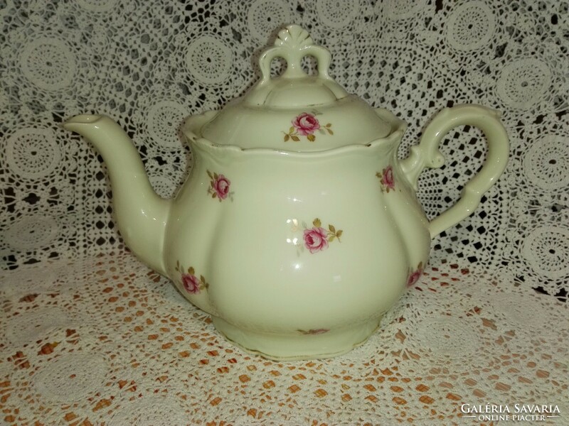 Old, red rose porcelain tea spout.