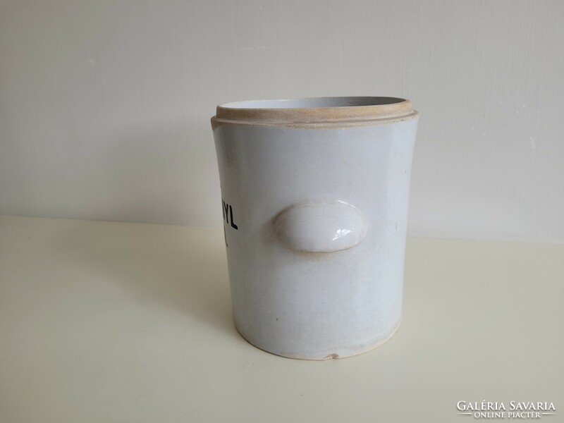 Old large-sized stoneware apothecary jar with a label, a pharmacy storage jar with a handle