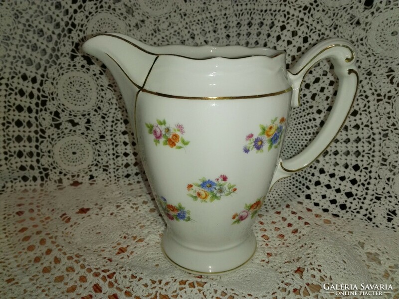 Floral porcelain spout.