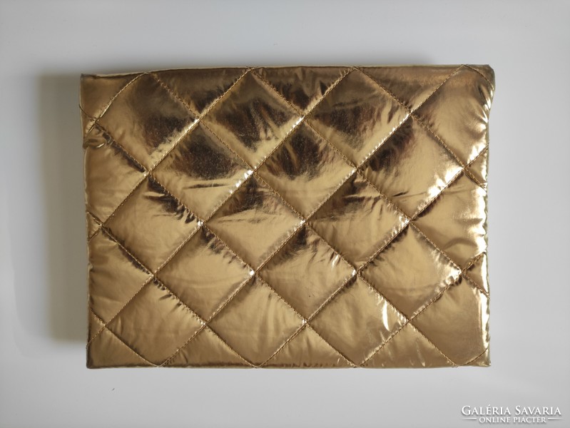 Gold quilted patent pouffe handbag