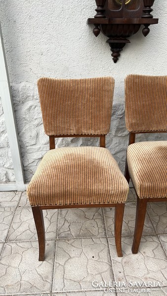 Art deco style upholstered chairs in a pair