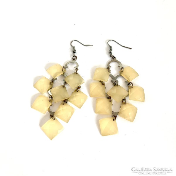 Long beige vintage earrings with hooks, the jewelry is from the 1980s