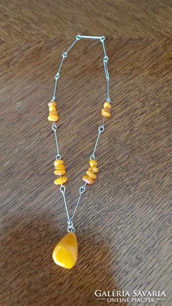 I discounted it! Honey amber necklace with alpaca chain. Beautiful with a big stone in the middle