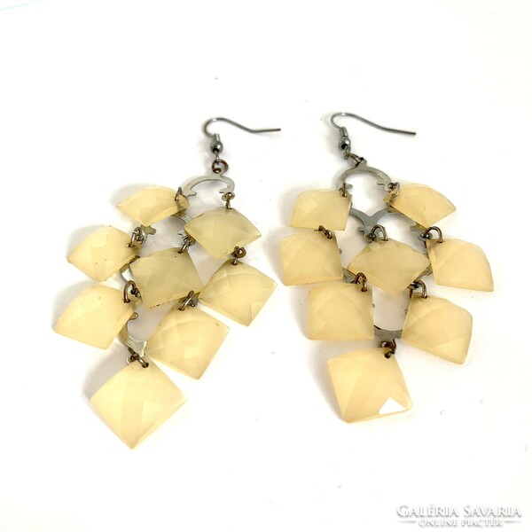 Long beige vintage earrings with hooks, the jewelry is from the 1980s