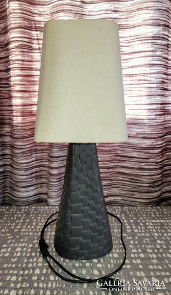 Art deco bedside lamp with a braided pattern and a ceramic body