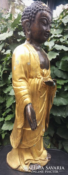 Gilded bronze standing Buddha statue