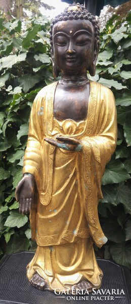 Gilded bronze standing Buddha statue