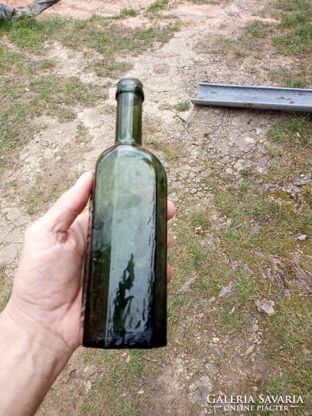 Old tinctured green bottle