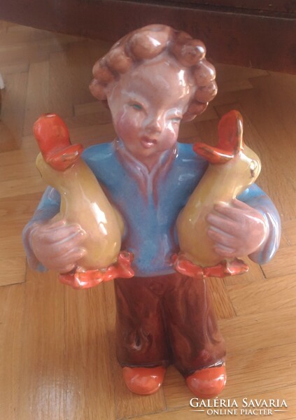 Ceramic statue of a girl with ducks