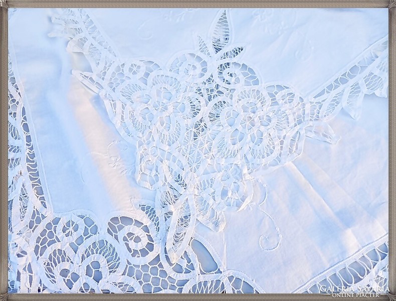 Huge, hand-embroidered, richly patterned, snow-white festive tablecloth