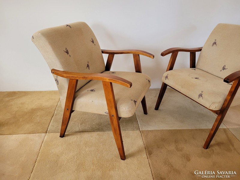 Old retro armchair mid century with wooden arms